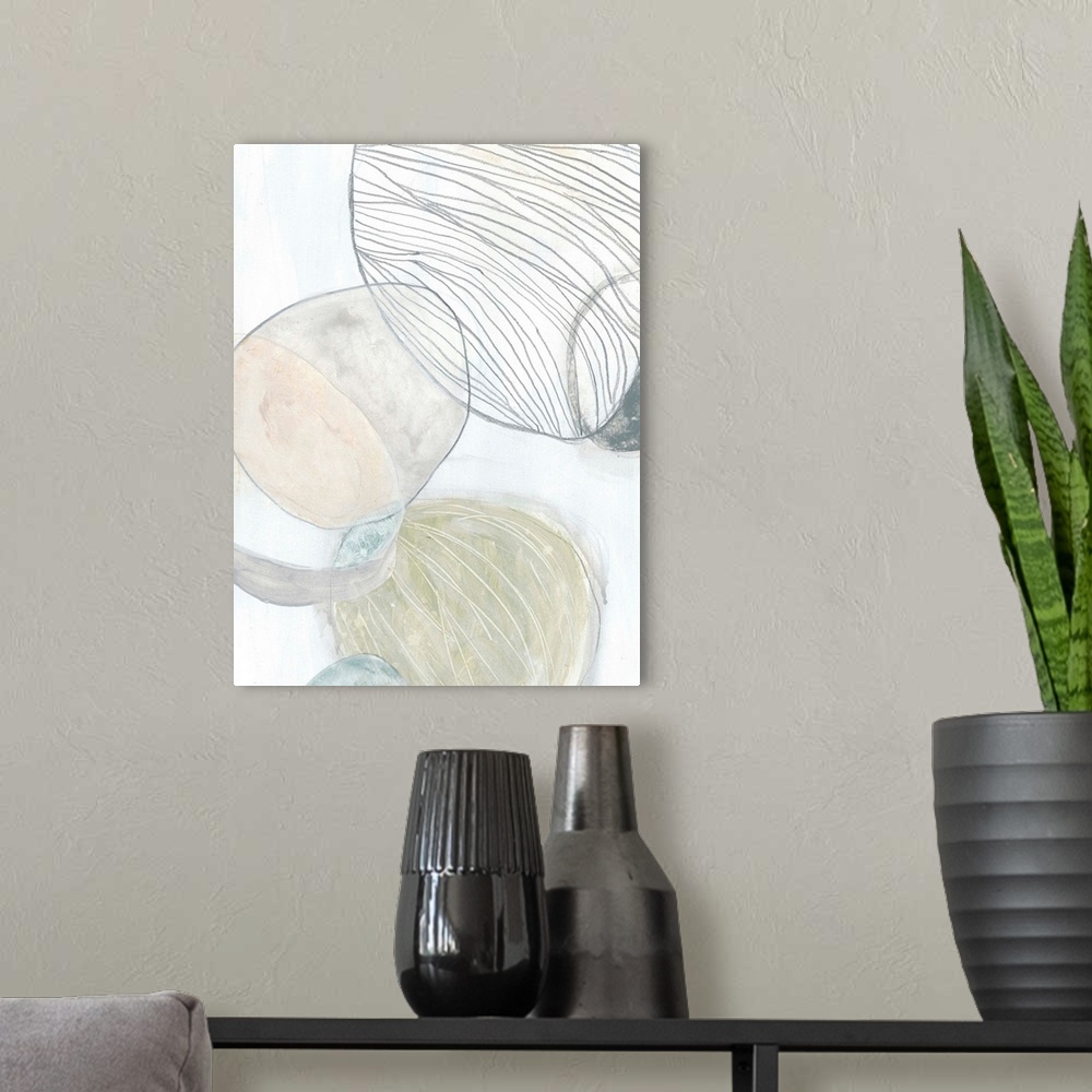 A modern room featuring Abstract artwork illustrating the texture of pebbles found at a beach.