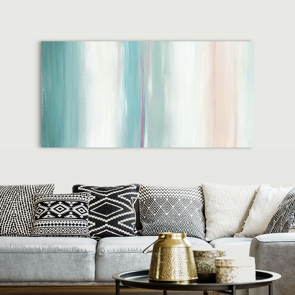 A bohemian room featuring Abstract artwork in pink, white, and teal, in vertical stripes.