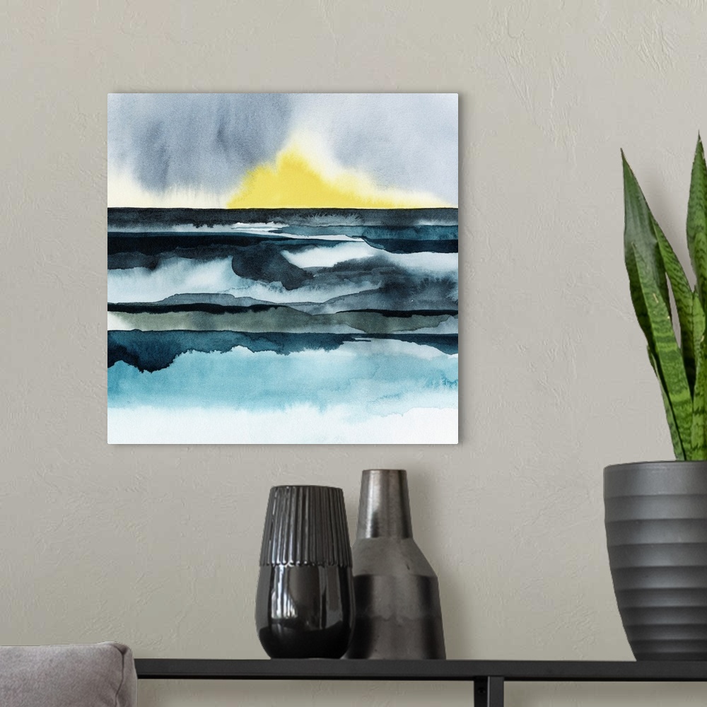 A modern room featuring Watercolor art print of a seascape with the bright yellow sun setting on the horizon.