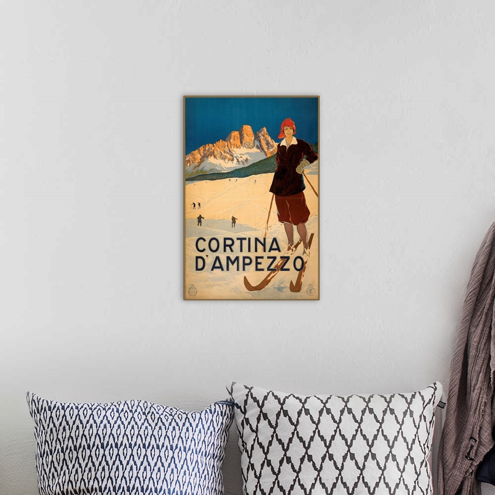 A bohemian room featuring Vintage travel advertisement for Cortina, Italy, with a female skier.