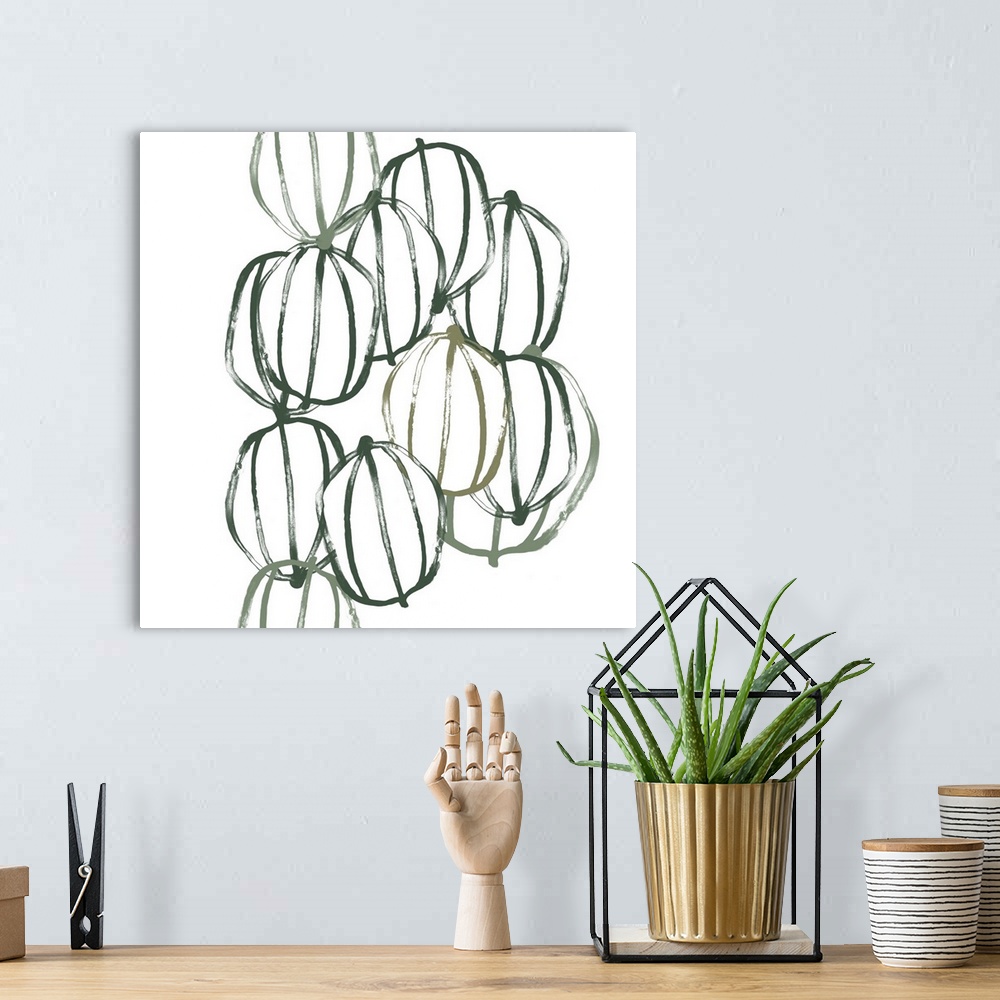 A bohemian room featuring Square contemporary artwork of seed pods in shades of green over a white background.