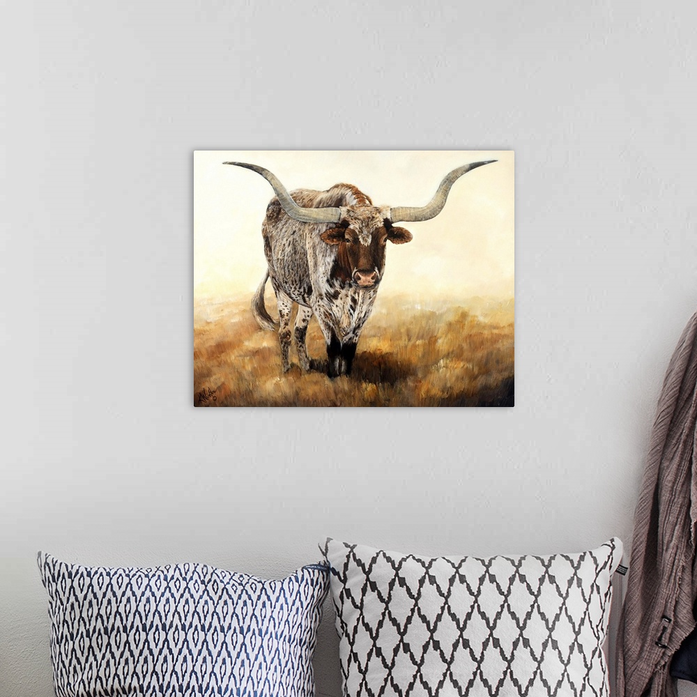 A bohemian room featuring Horizontal contemporary artwork of a longhorn cow grazing on a field in warm tones.