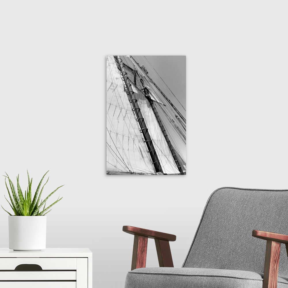 A modern room featuring Black and white photograph of details of a sailboat.