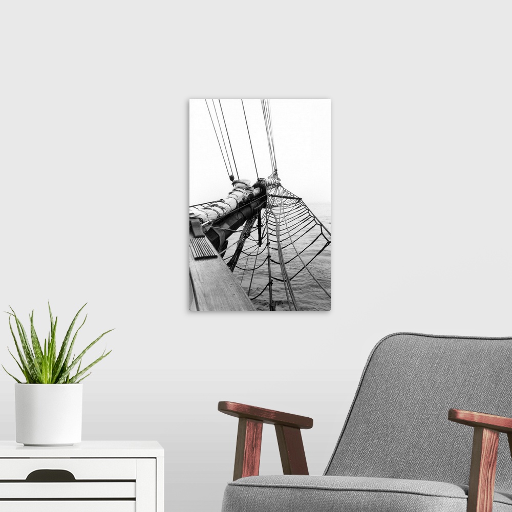 A modern room featuring Black and white photograph of details of a sailboat.