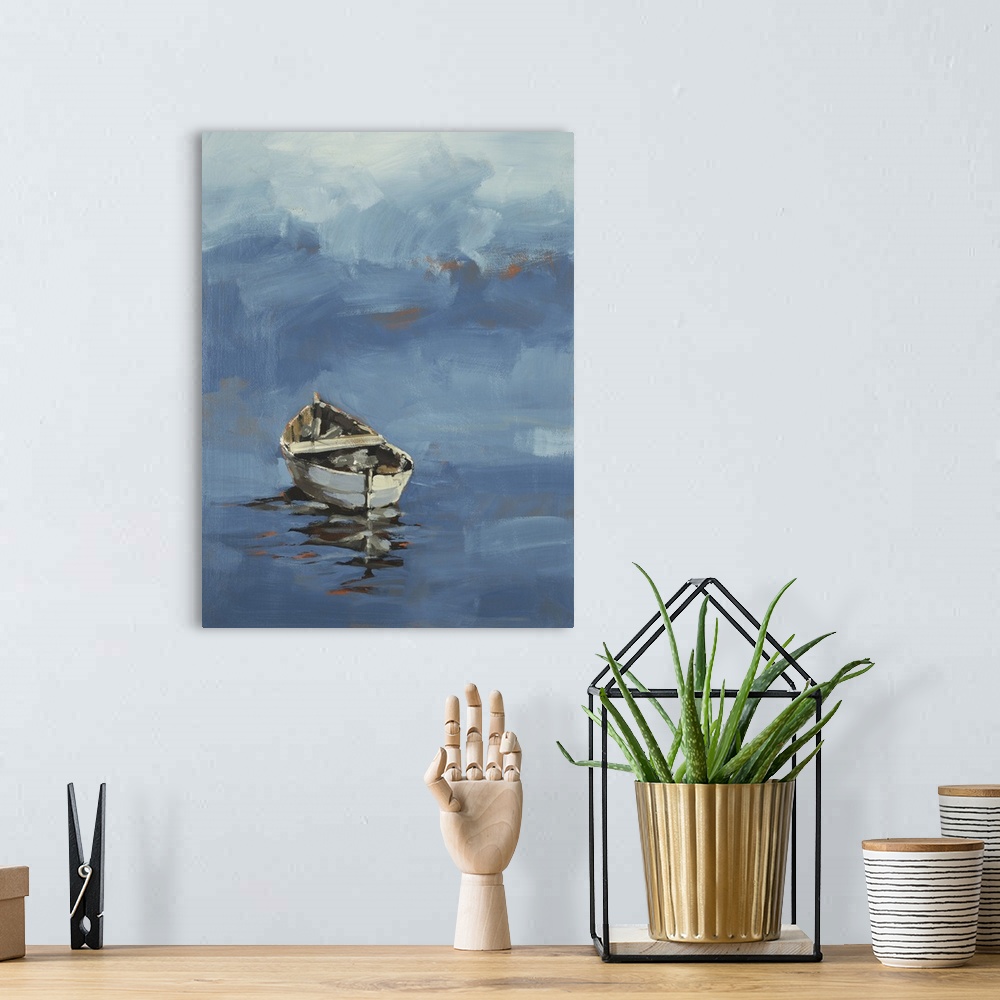 A bohemian room featuring Art print of a lonely wooden boat floating on the water.