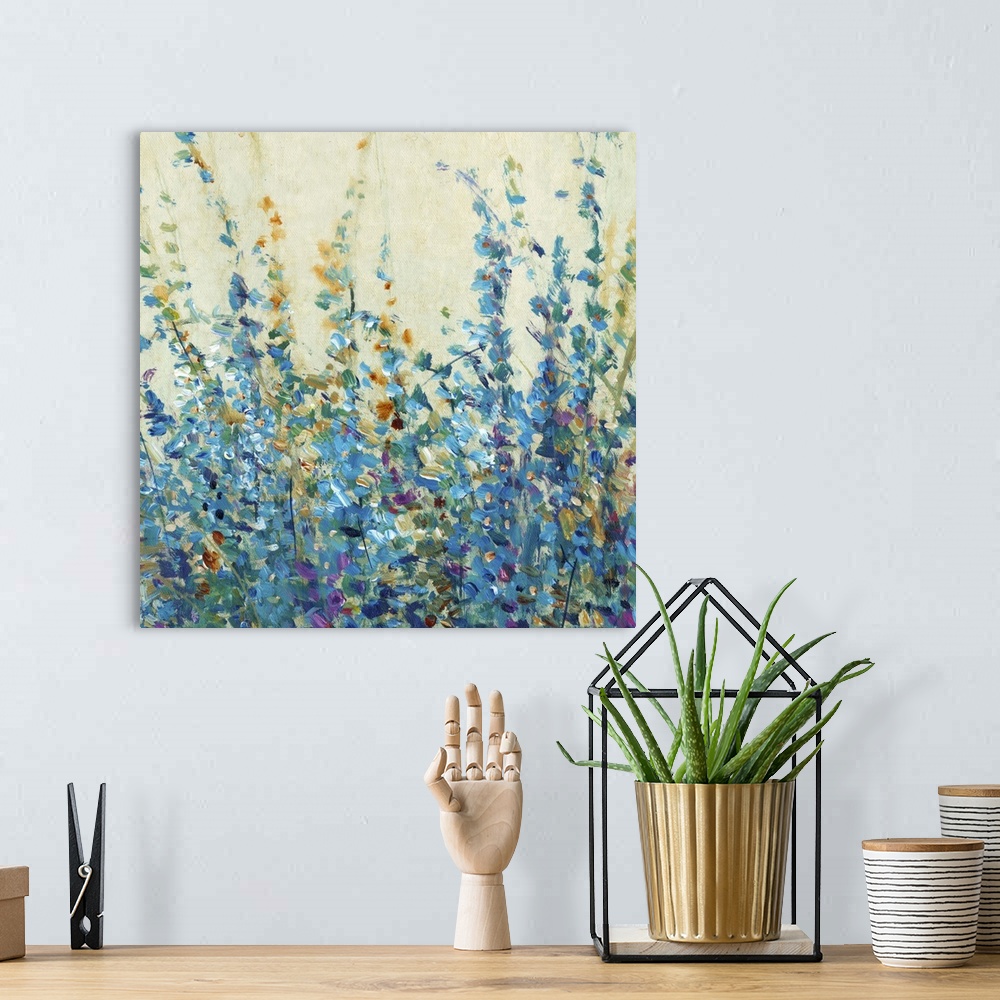 A bohemian room featuring Blue toned contemporary painting of flowers.
