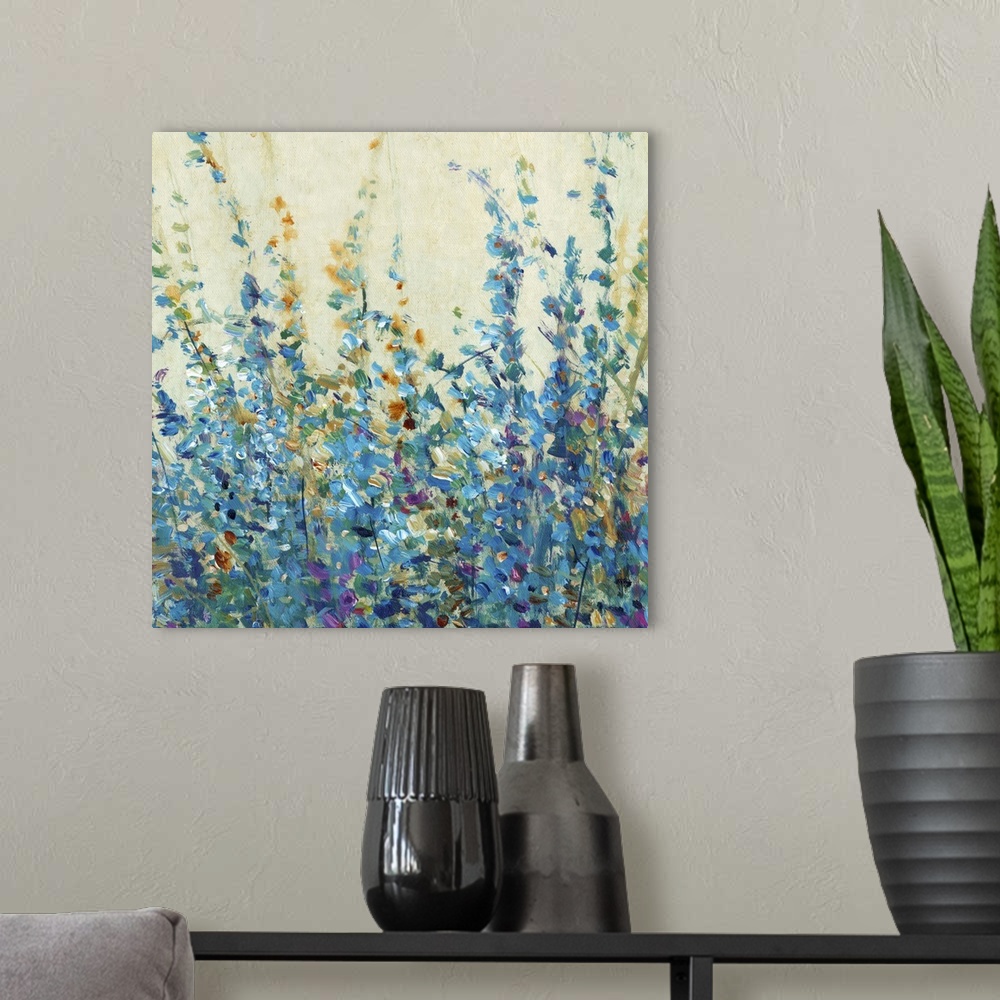 A modern room featuring Blue toned contemporary painting of flowers.