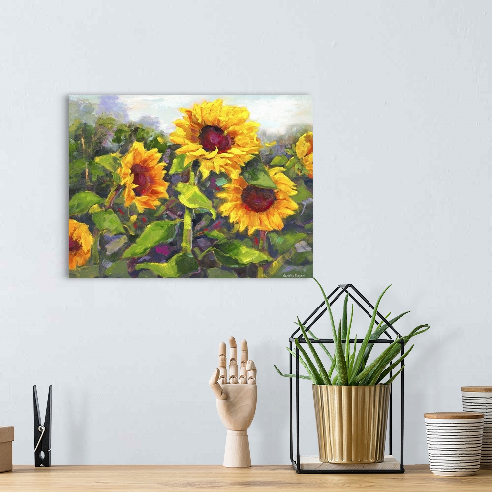 A bohemian room featuring Contemporary painting of a group of bright sunflowers in bloom.