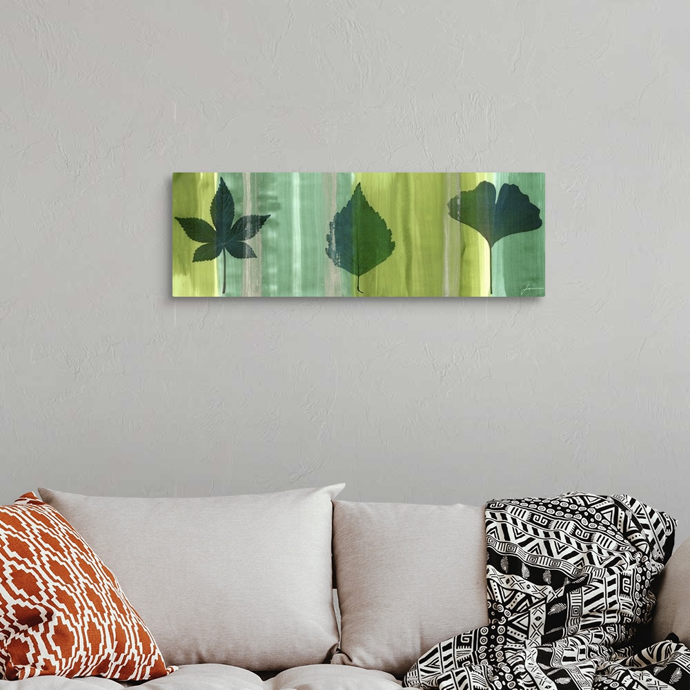 A bohemian room featuring Contemporary artwork of an outline of a leaf against a multi-green toned background.