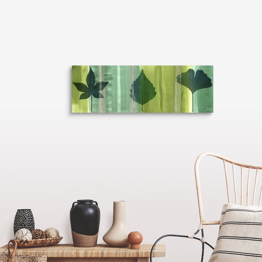 A farmhouse room featuring Contemporary artwork of an outline of a leaf against a multi-green toned background.