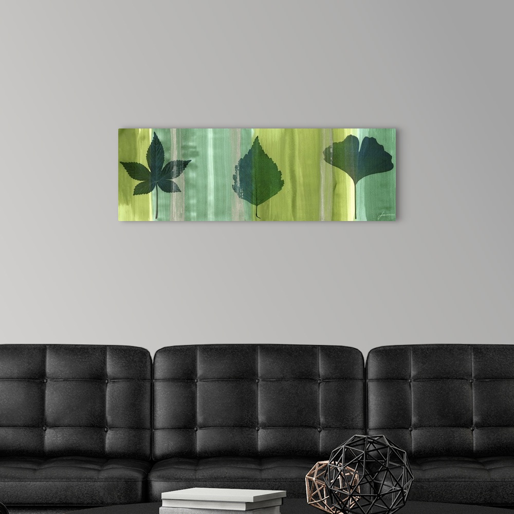 A modern room featuring Contemporary artwork of an outline of a leaf against a multi-green toned background.