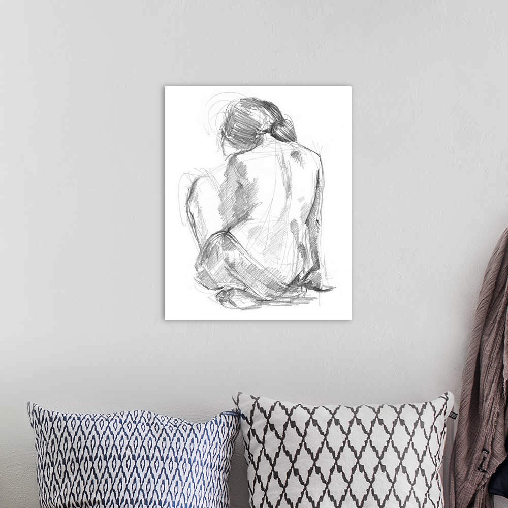 A bohemian room featuring Drawing of the back of a nude woman looking downwards on a white background.