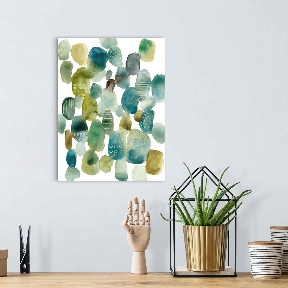 A bohemian room featuring This contemporary artwork contains blue and green pebbles of color with some that are decorated w...