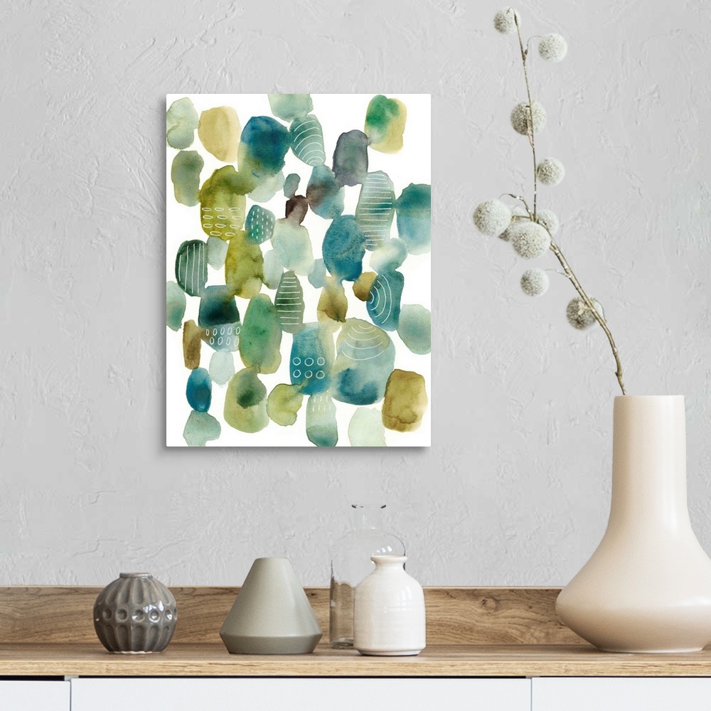 A farmhouse room featuring This contemporary artwork contains blue and green pebbles of color with some that are decorated w...