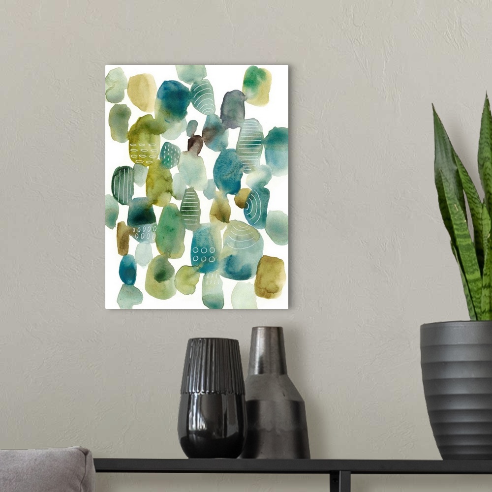 A modern room featuring This contemporary artwork contains blue and green pebbles of color with some that are decorated w...