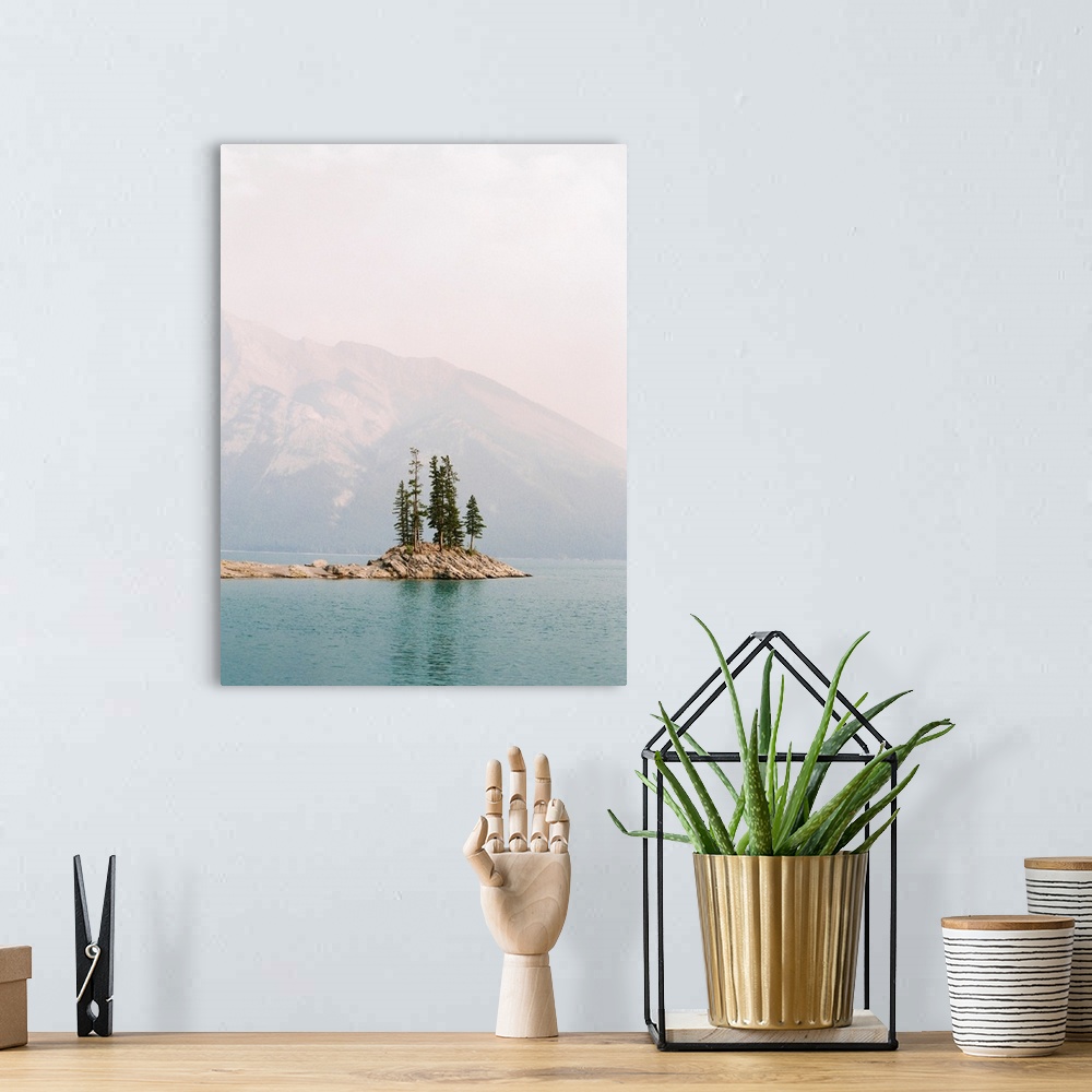 A bohemian room featuring Photograph of several trees on a small island under a hazy sky, Banff, Canada.