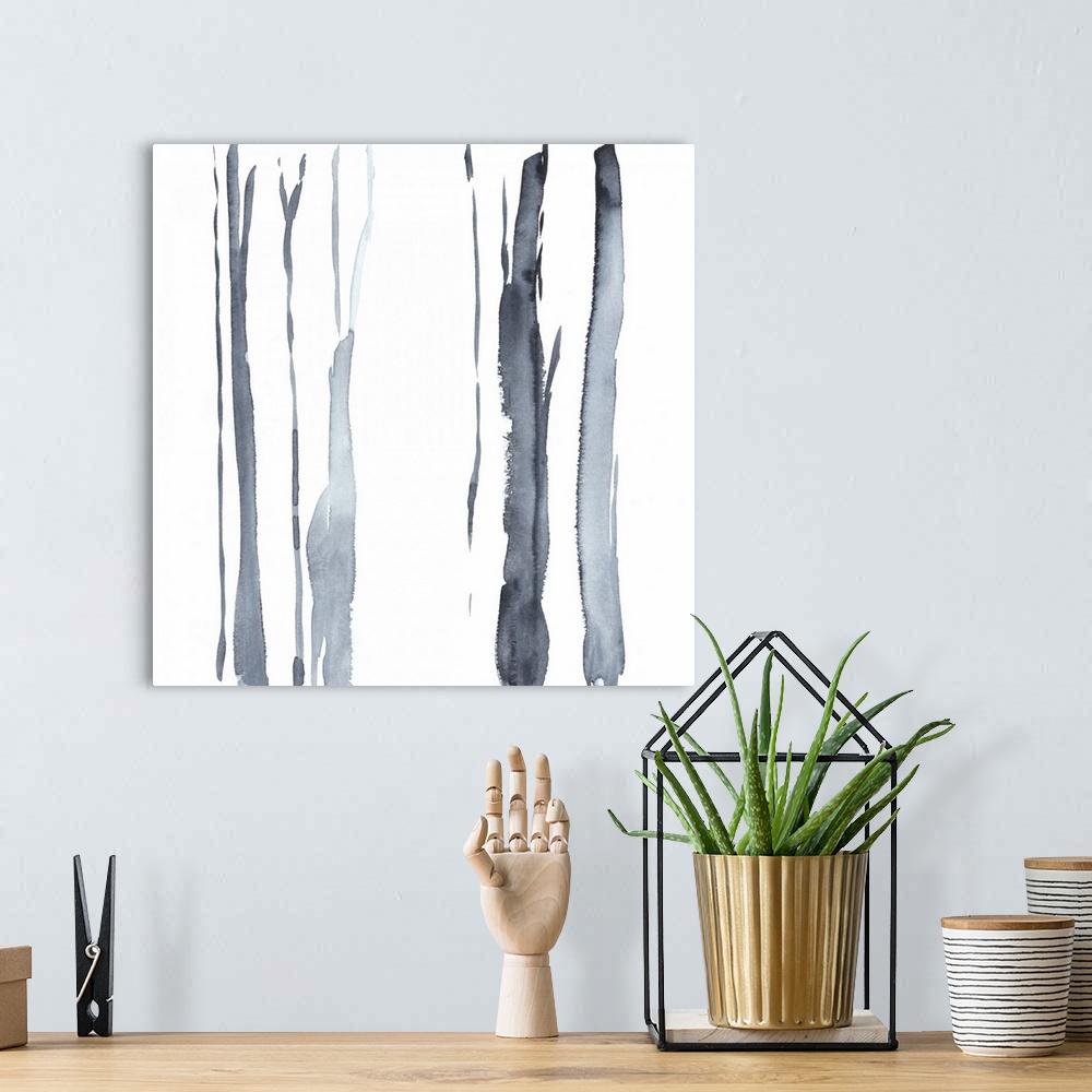A bohemian room featuring Square watercolor painting of abstract tree trunks in gray against a white background.