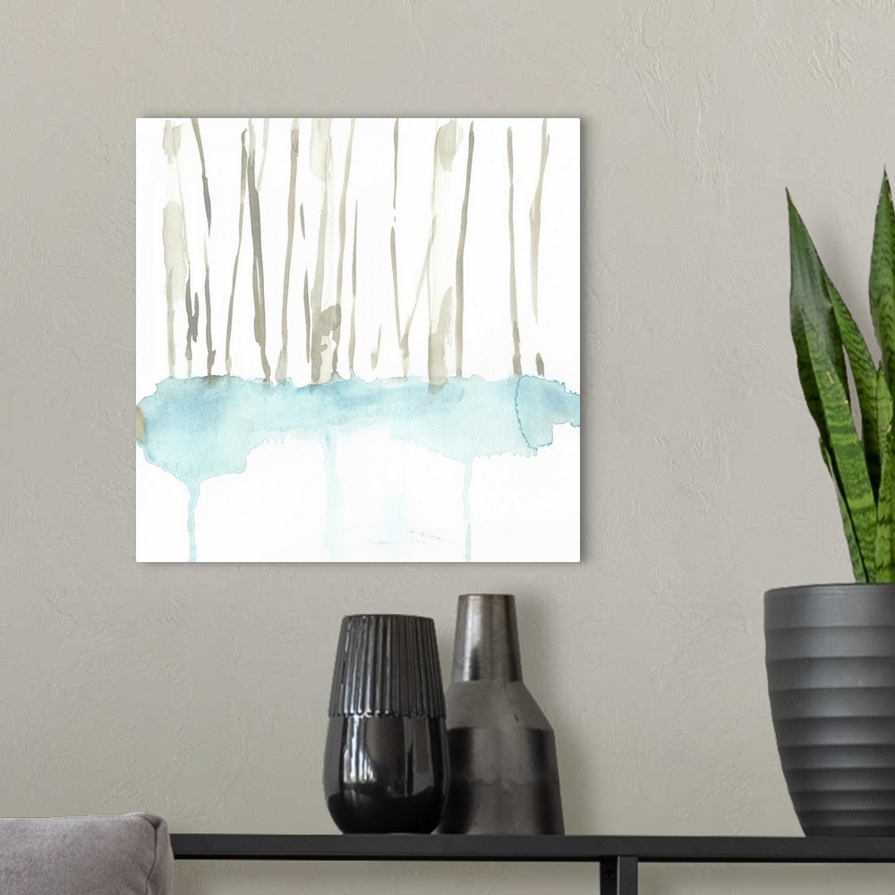 A modern room featuring Square watercolor painting of abstract tree trunks in brown with snow against a white background.