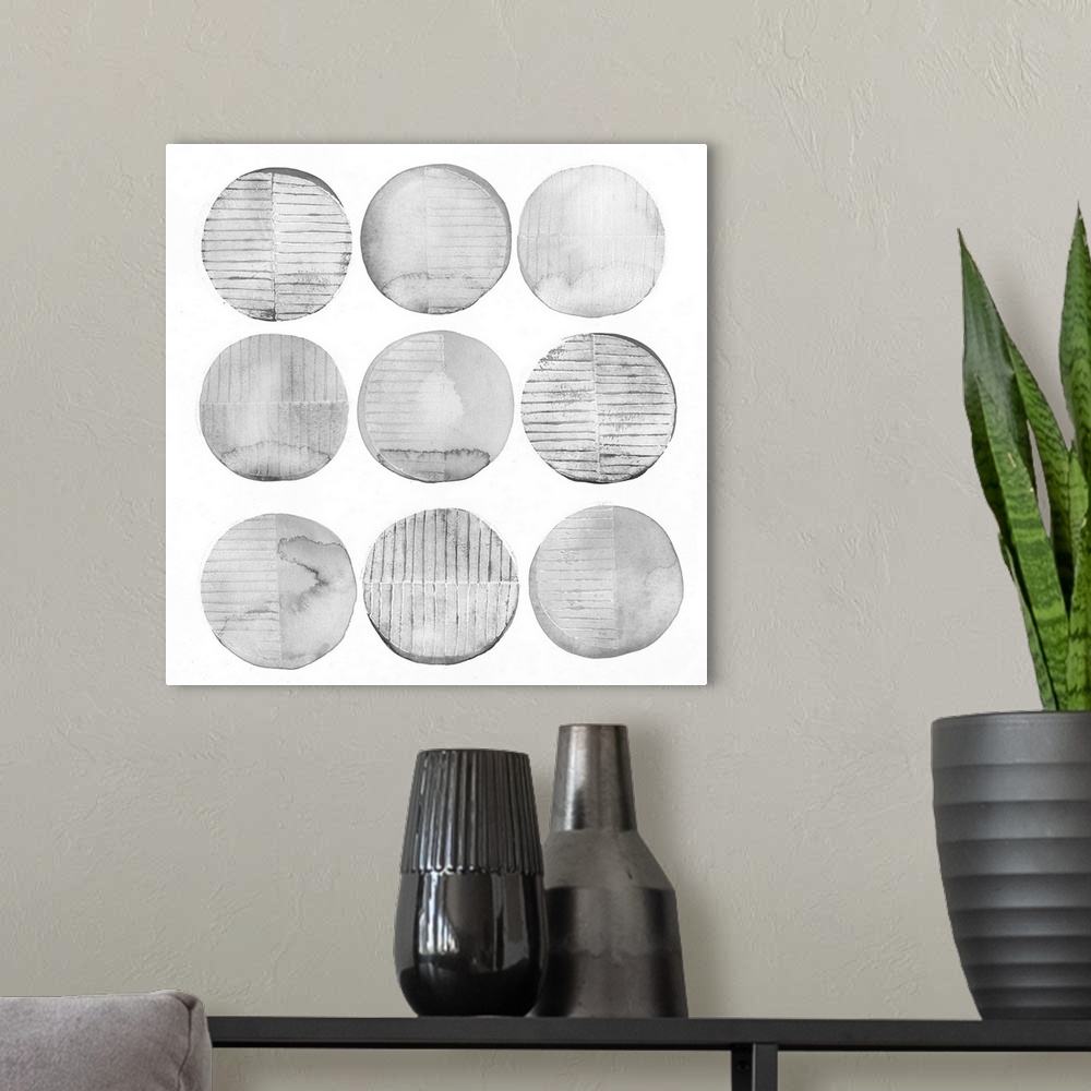 A modern room featuring Nine round shapes in pale grey with striped patterns.