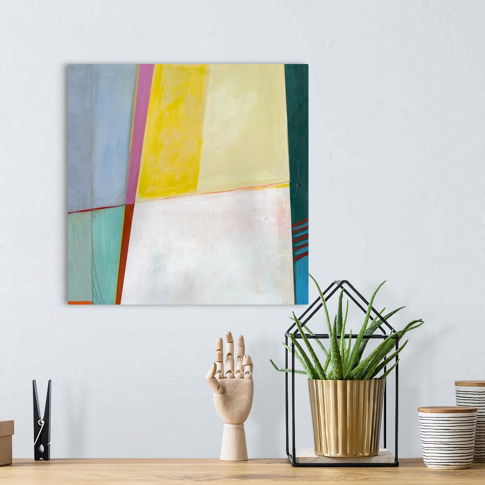 A bohemian room featuring Abstract artwork with bright sections of color.