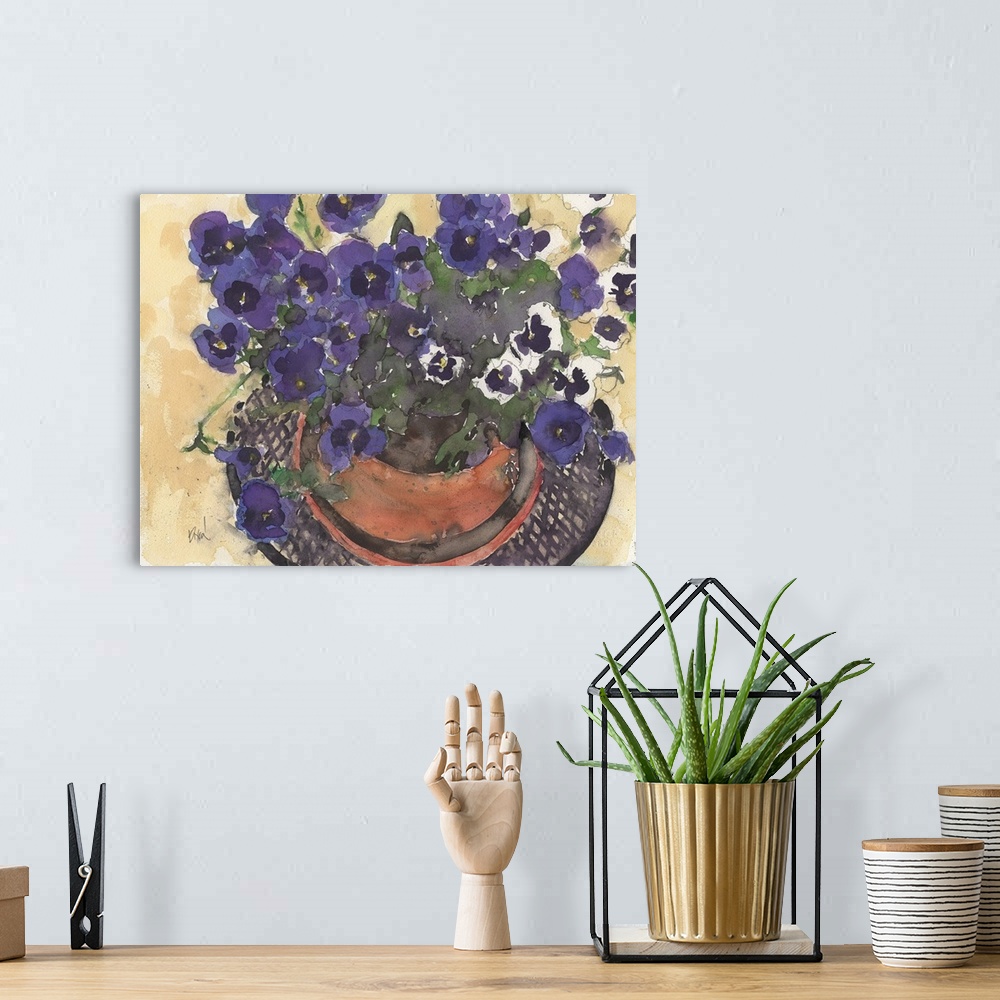 A bohemian room featuring Watercolor painting of bright purple pansies in a pot.