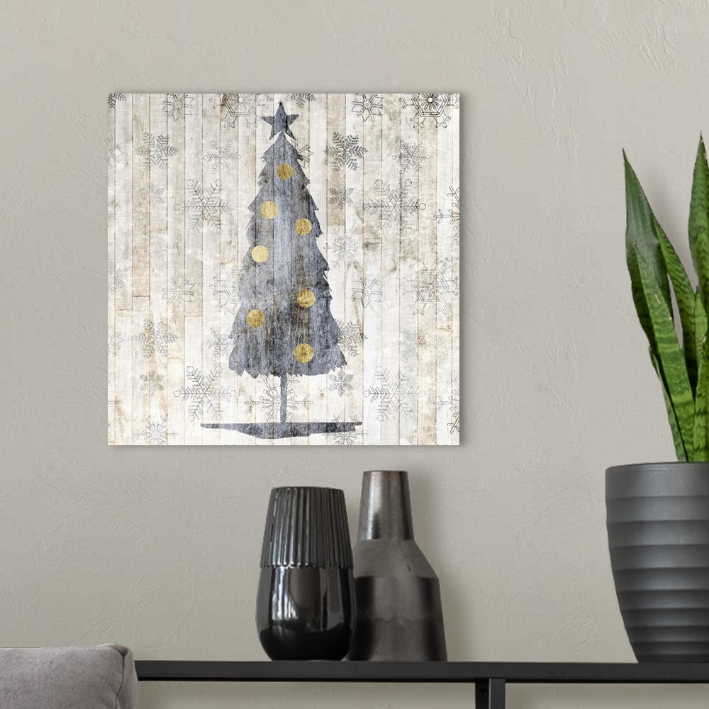 A modern room featuring Contemporary Christmas decor of a tree in silver tones.