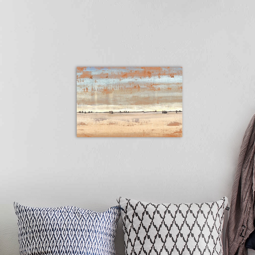 A bohemian room featuring Abstract landscape of an open desert under a pale sky.
