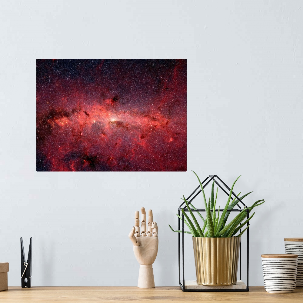 A bohemian room featuring Photograph of a deep red and black outer space with millions of stars.