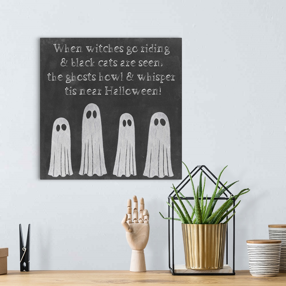 A bohemian room featuring Decorative holiday print for Halloween with ghosts.