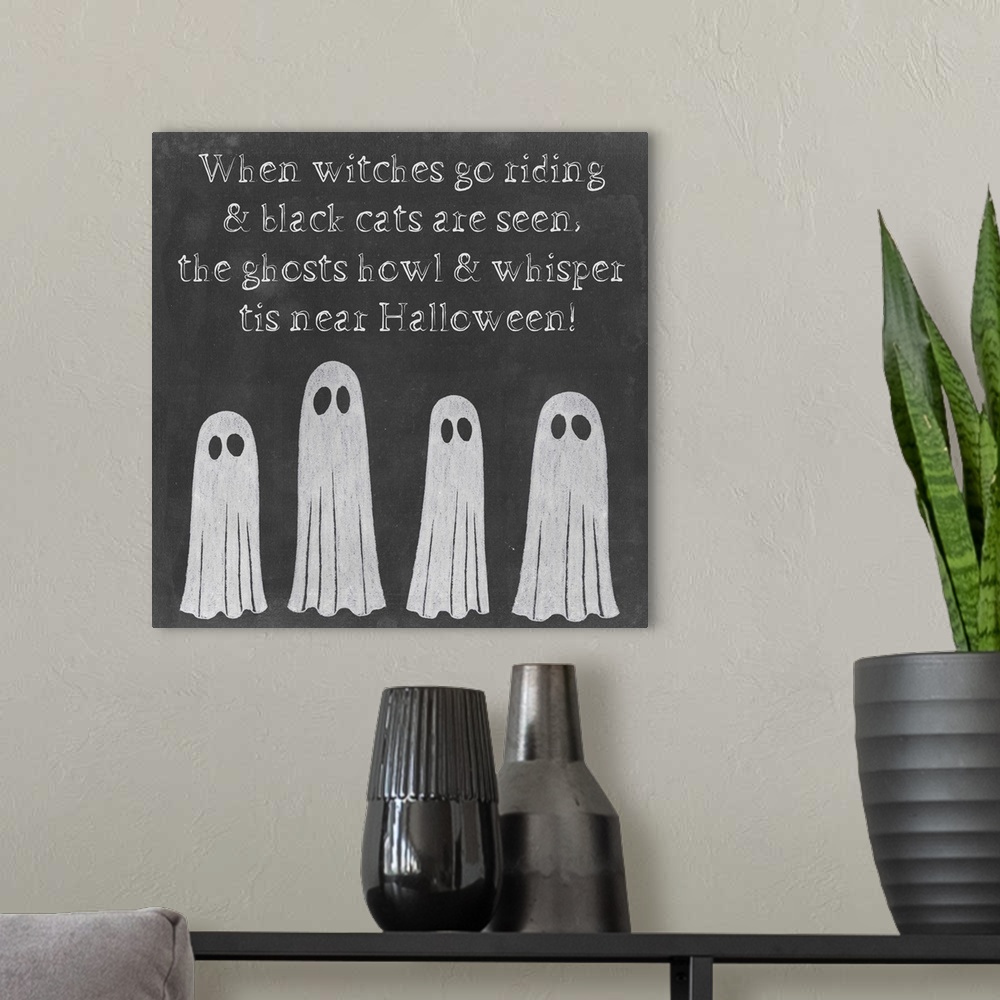 A modern room featuring Decorative holiday print for Halloween with ghosts.