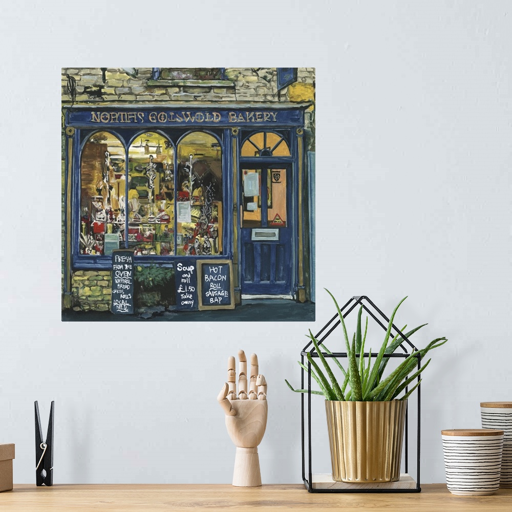 A bohemian room featuring A square decorative image of menus outside a blue painted bakery in England.