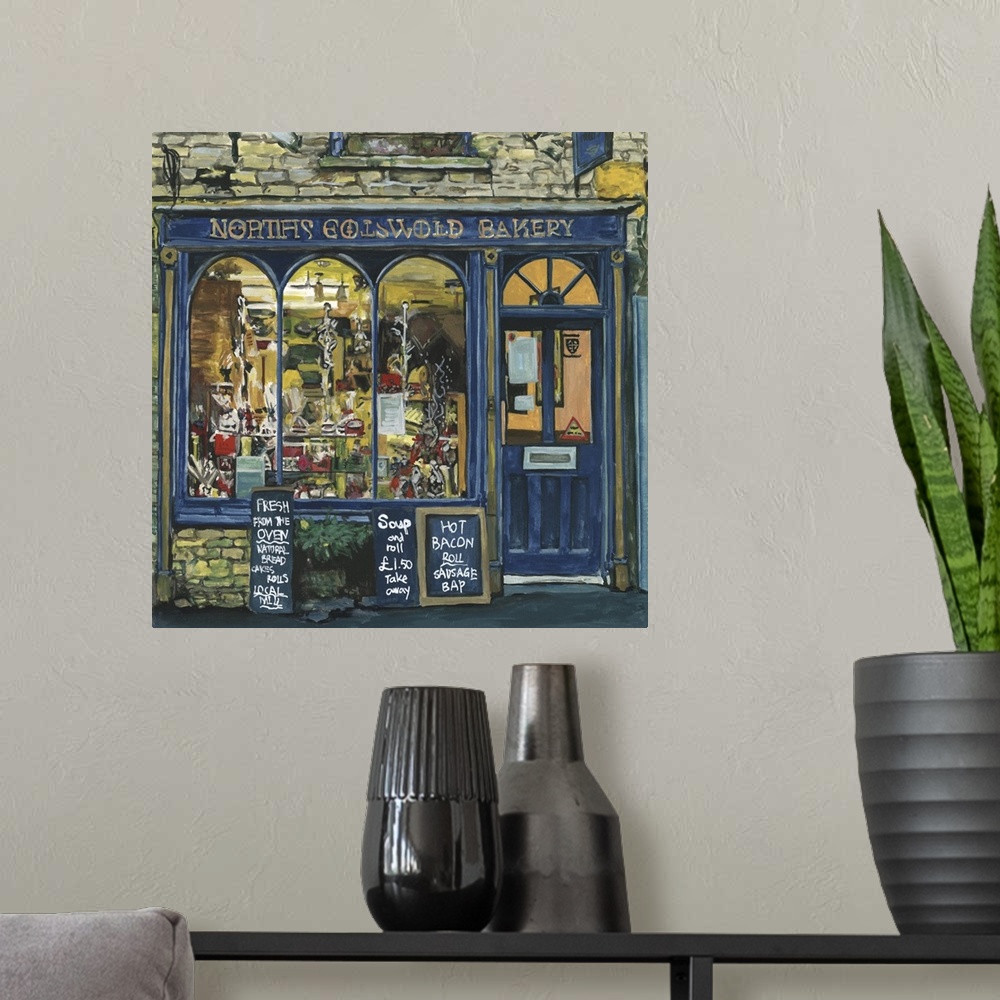 A modern room featuring A square decorative image of menus outside a blue painted bakery in England.