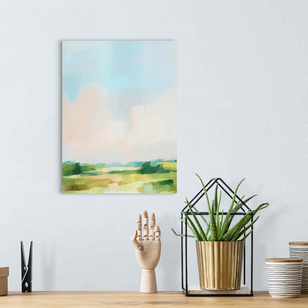 A bohemian room featuring Contemporary abstract painting highlighting a pale blue sky over a green landscape.