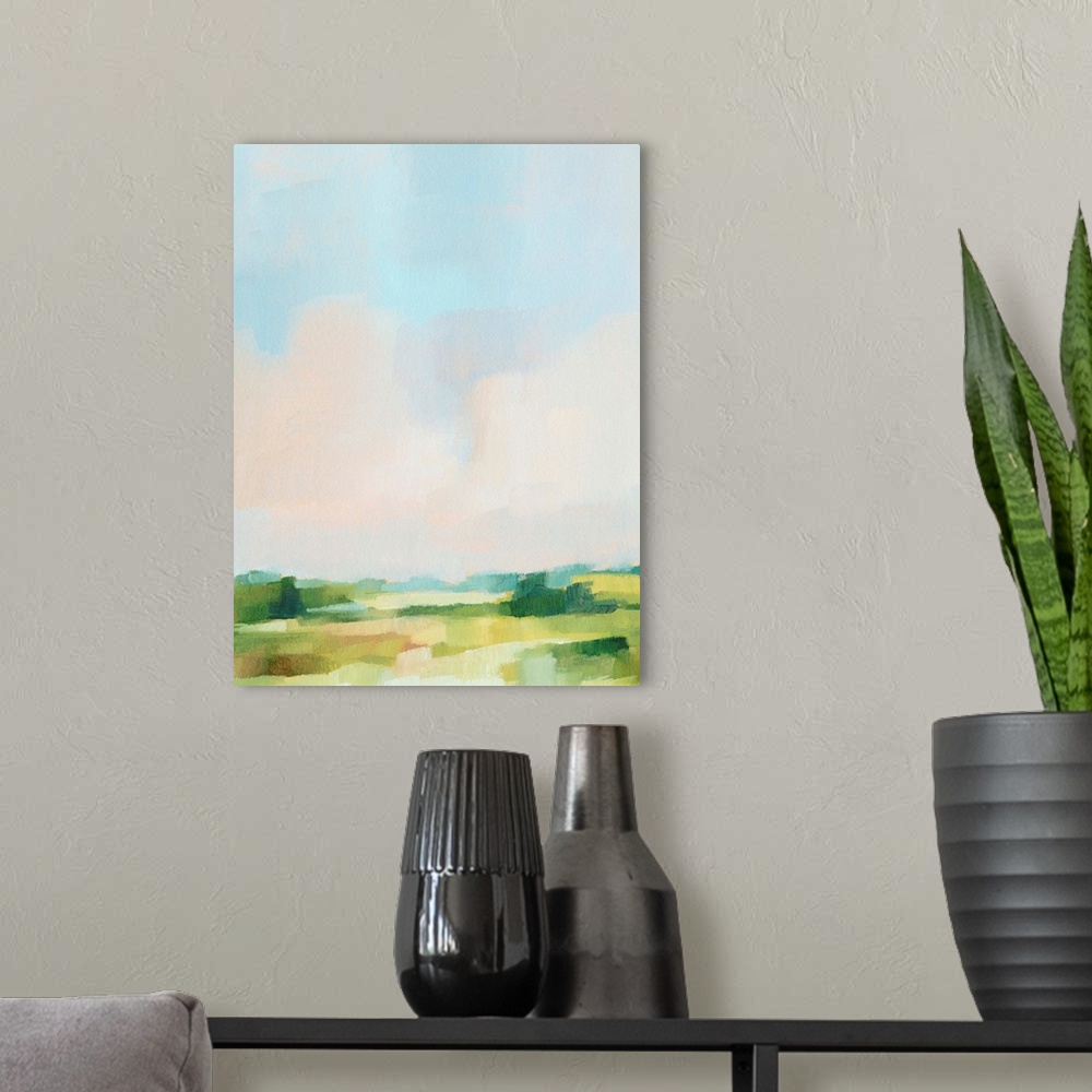 A modern room featuring Contemporary abstract painting highlighting a pale blue sky over a green landscape.