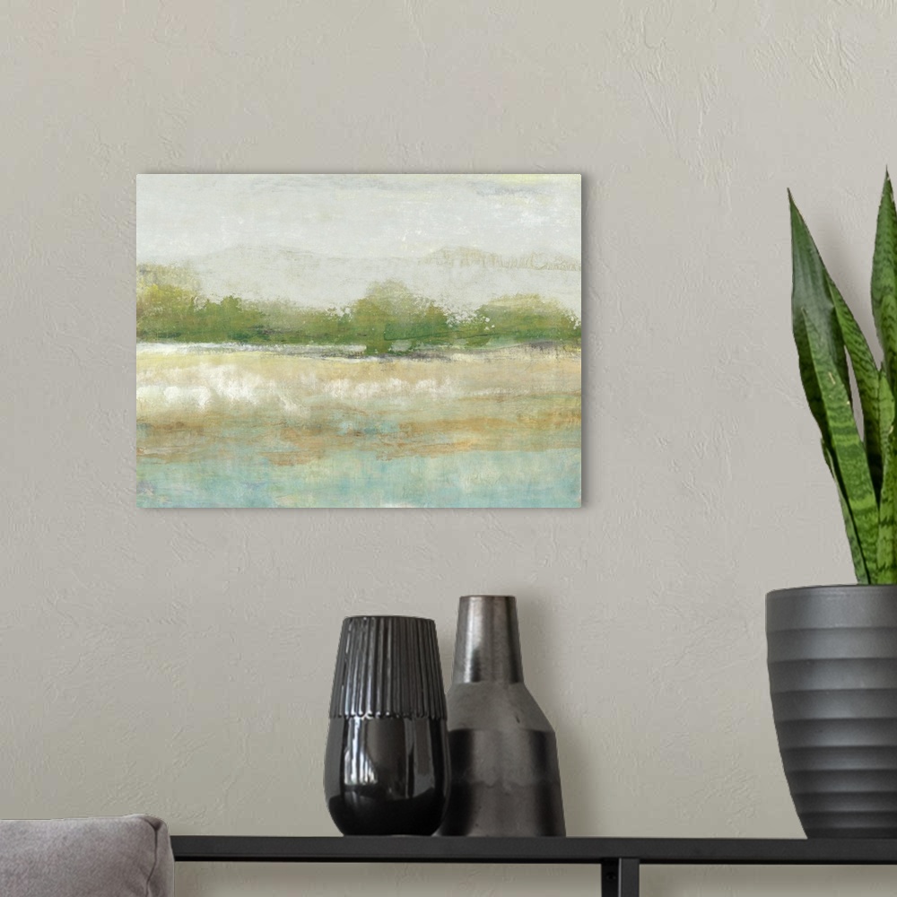 A modern room featuring Contemporary landscape painting of a meadow with green trees along the edge.