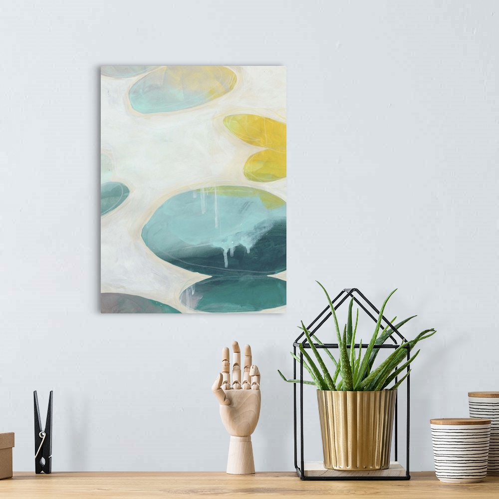 A bohemian room featuring Contemporary abstract painting using organic shapes in vibrant colors against an off-white backgr...