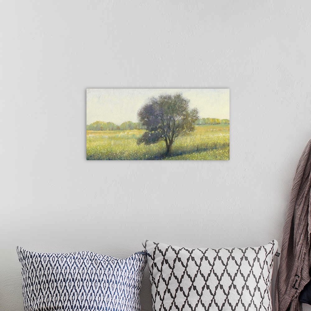 A bohemian room featuring Contemporary landscape painting of a tree in an empty rural field.
