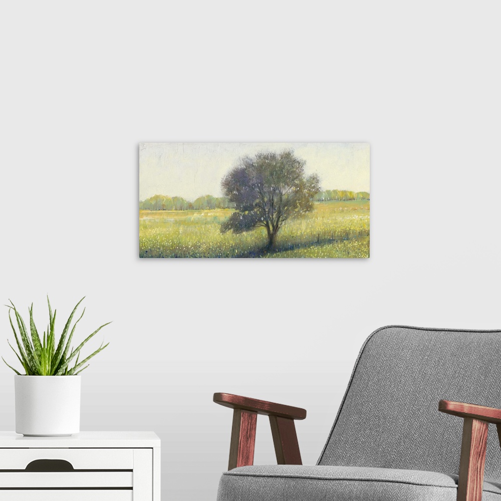 A modern room featuring Contemporary landscape painting of a tree in an empty rural field.