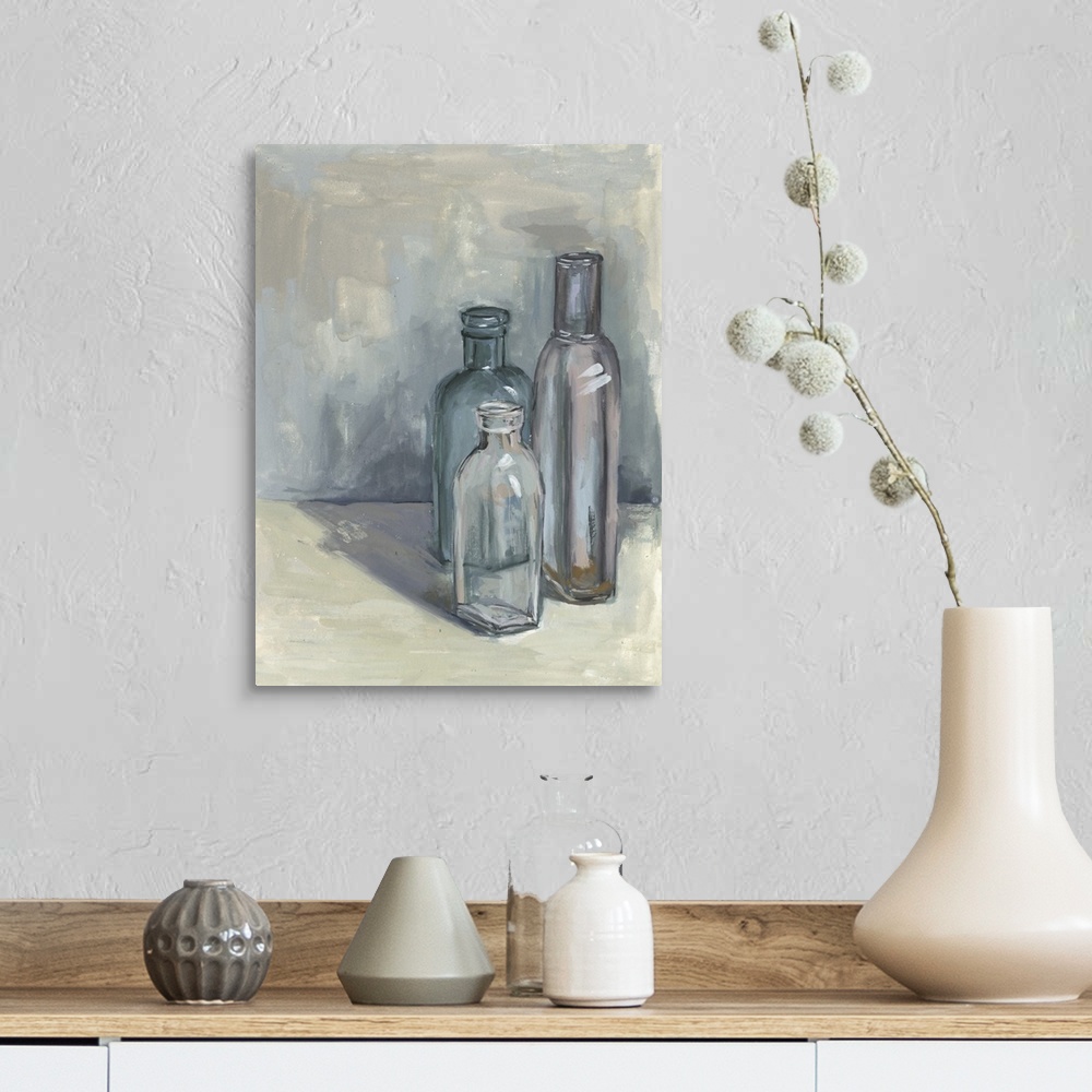A farmhouse room featuring Contemporary still life painting of a group of glass bottles in different sizes against a neutral...