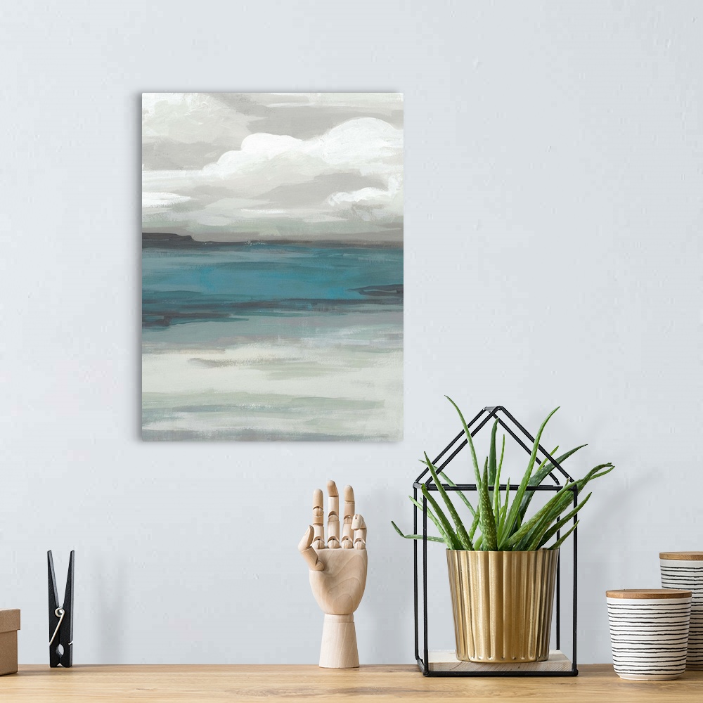 A bohemian room featuring A simple painting of a stormy, overcast sky above a tranquil sea.