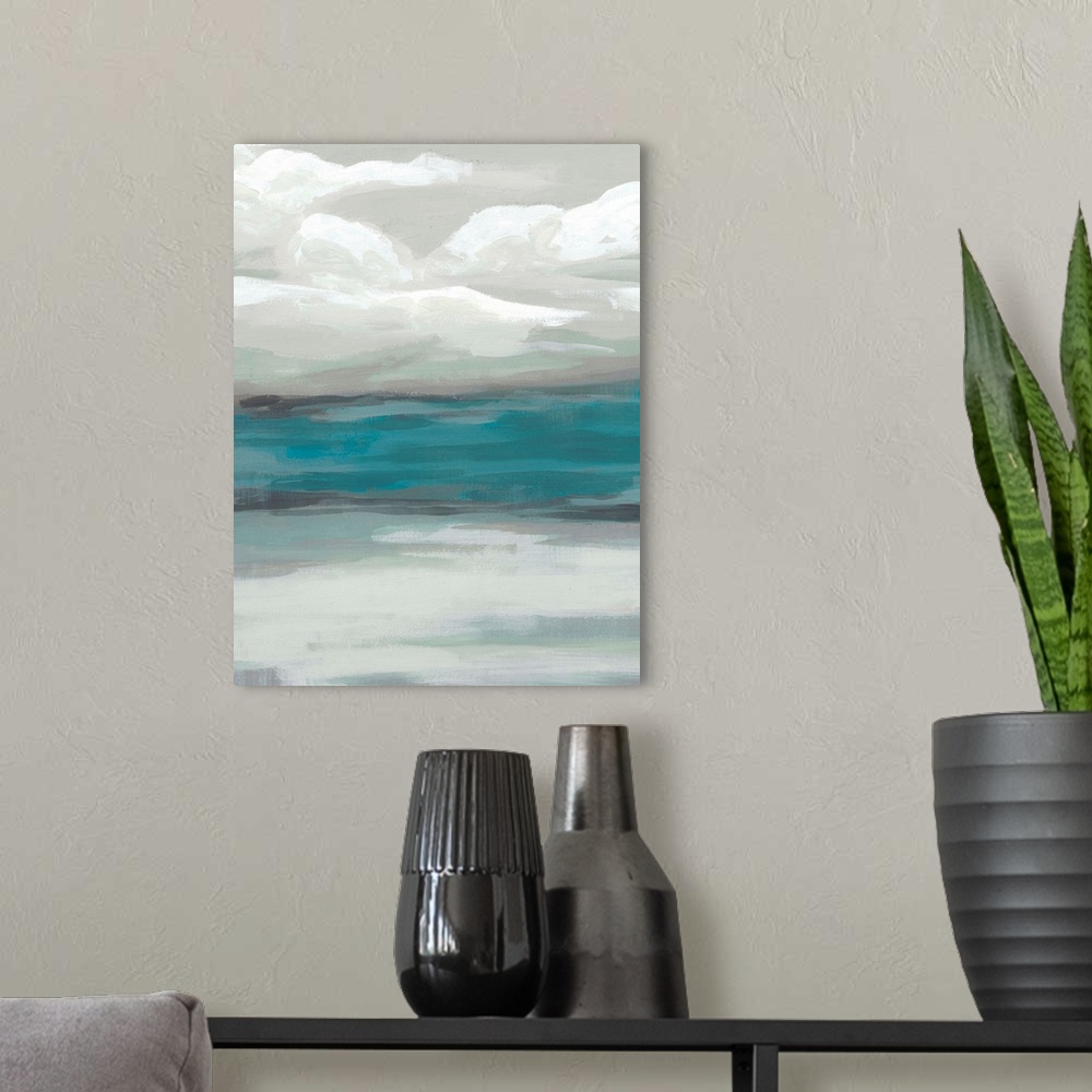 A modern room featuring A simple painting of a stormy, overcast sky above a tranquil sea.