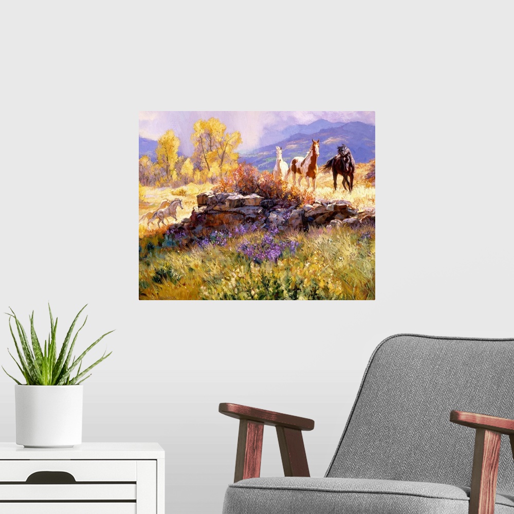 A modern room featuring Contemporary colorful painting of a herd of horses standing in a rugged landscape, with a mountai...