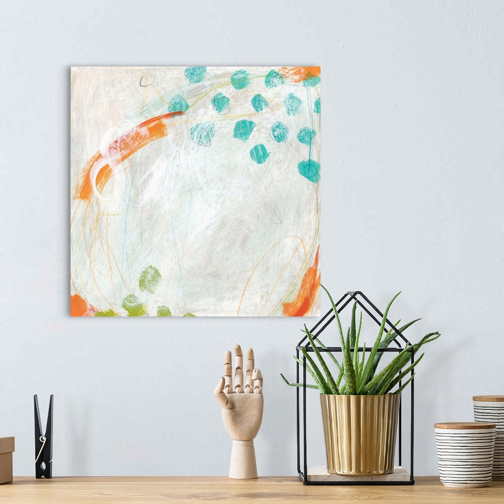 A bohemian room featuring Abstract painting with bright blue and green dots on a pale background.