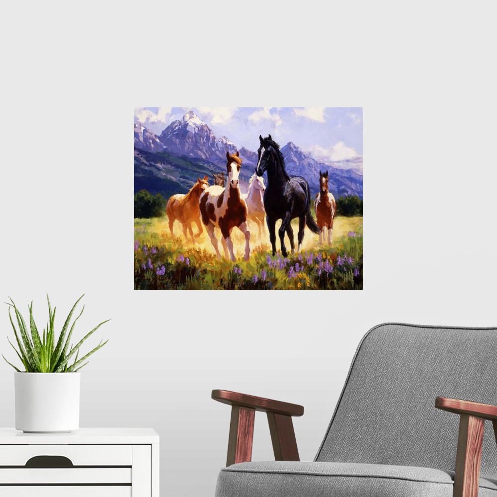 A modern room featuring Contemporary colorful painting of a herd of horses running through a meadow, with a mountain rang...