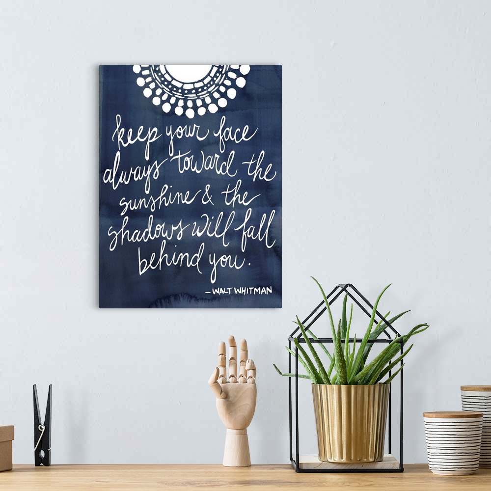 A bohemian room featuring Handwritten quote in white over a deep navy blue background.