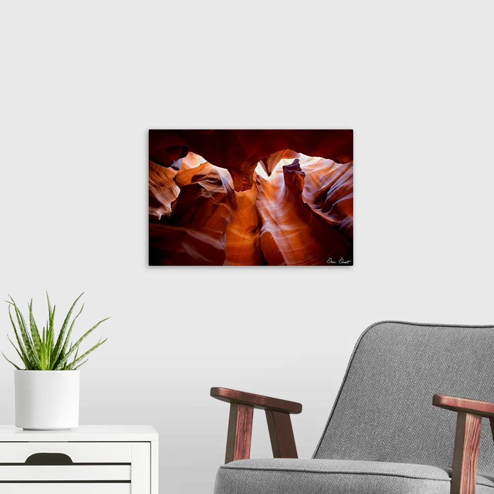 A modern room featuring Photograph of warm sunlight shining through Antelope Canyon in Arizona.