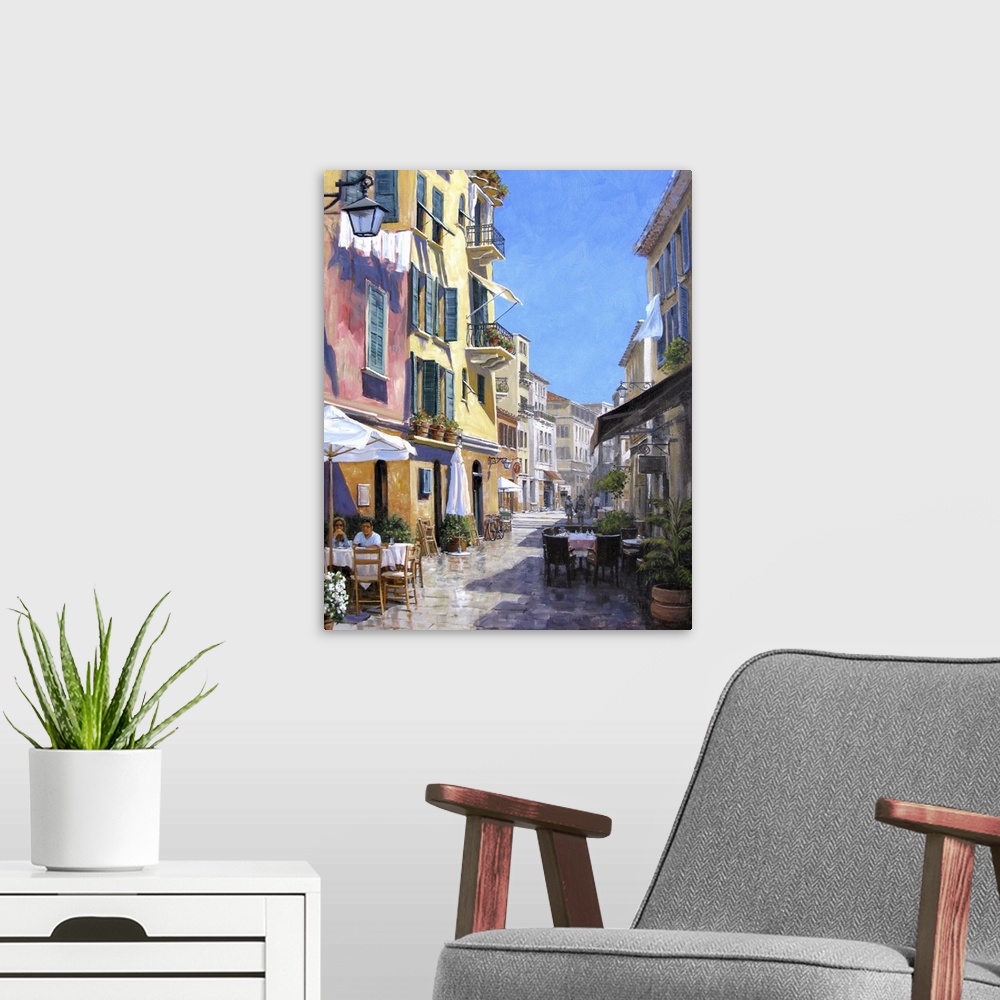 A modern room featuring Contemporary artwork of a street scene in the Italian town of Portofino.