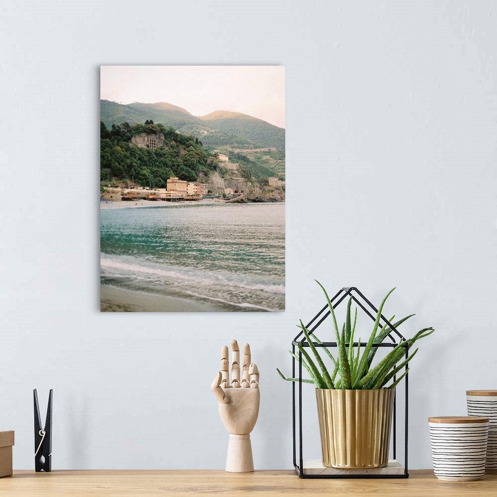 A bohemian room featuring Photograph of the water in front of a sunlit town, Cinque Terre, Italy.