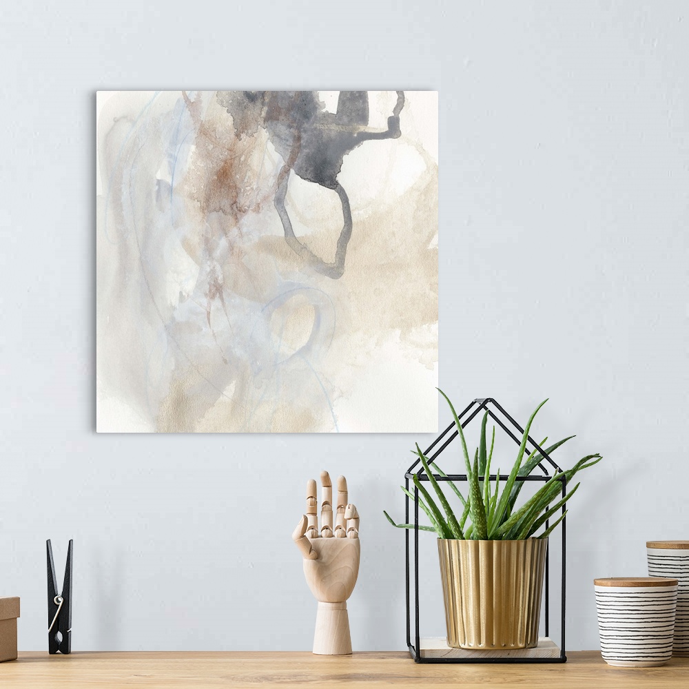 A bohemian room featuring Abstract watercolor painting in muted earth tones.