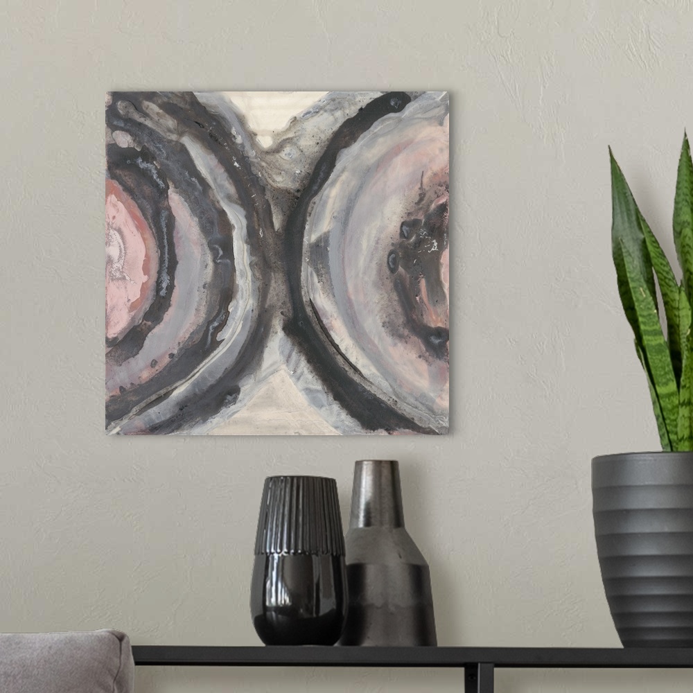 A modern room featuring Abstract contemporary art in muted shades of pink, grey, and white.